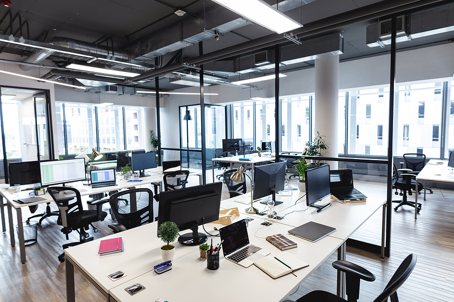 Interior of empty modern office with desks and computers. modern